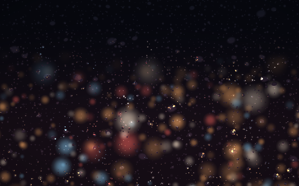 Rain on a window at night over a blurred city of amber, red and blue lights.